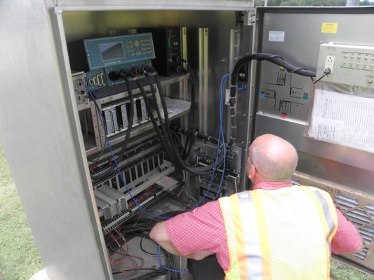 Photo of traffic cabinet being inspected